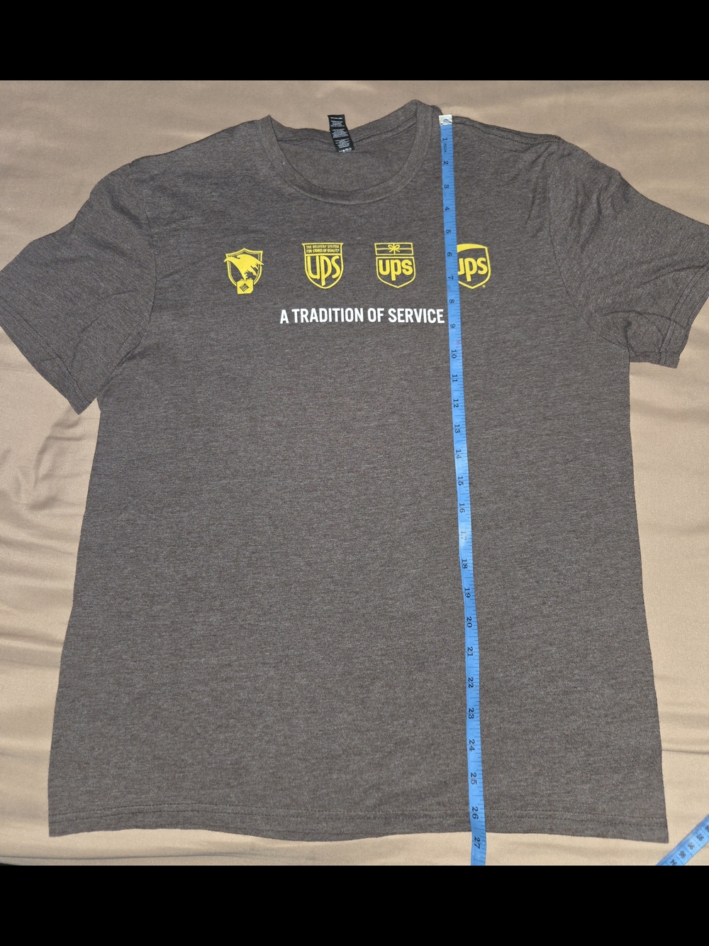 District Men's heathered brown Crewneck T-Shirt with Yellow UPS Logo Medium